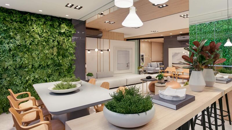 Sala moderna com jardim interno e plantas verdes.