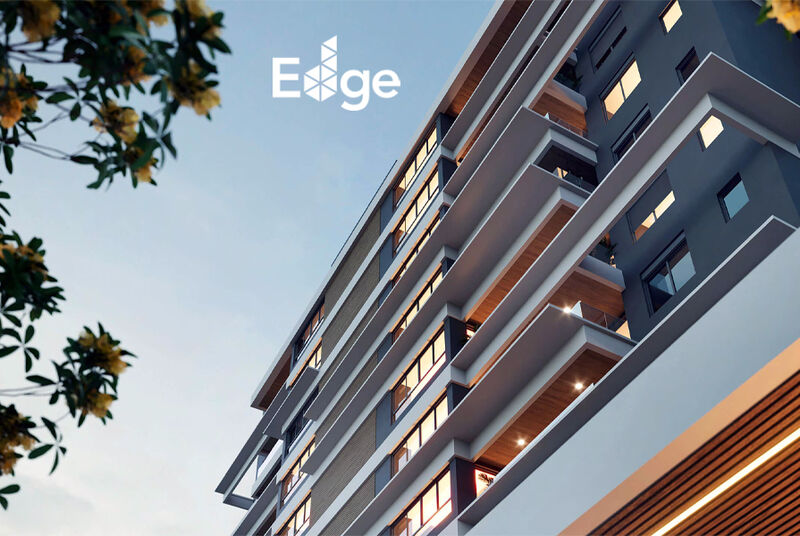 Fachada moderna do edifício Edge ao entardecer