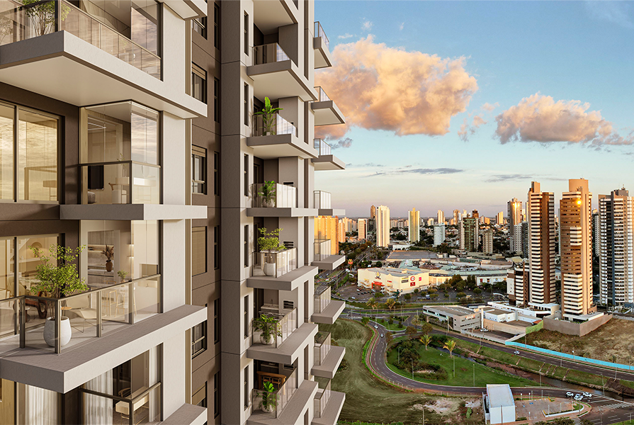 Vista aérea do empreendimento composto por varandas em cascata, cercado por uma paisagem urbana com outros edifícios. 