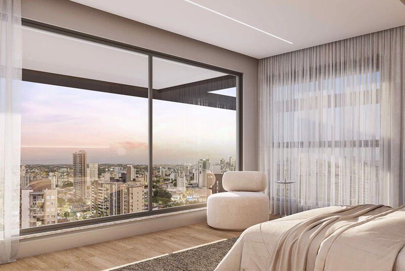 Quarto moderno com vista para a cidade ao anoitecer