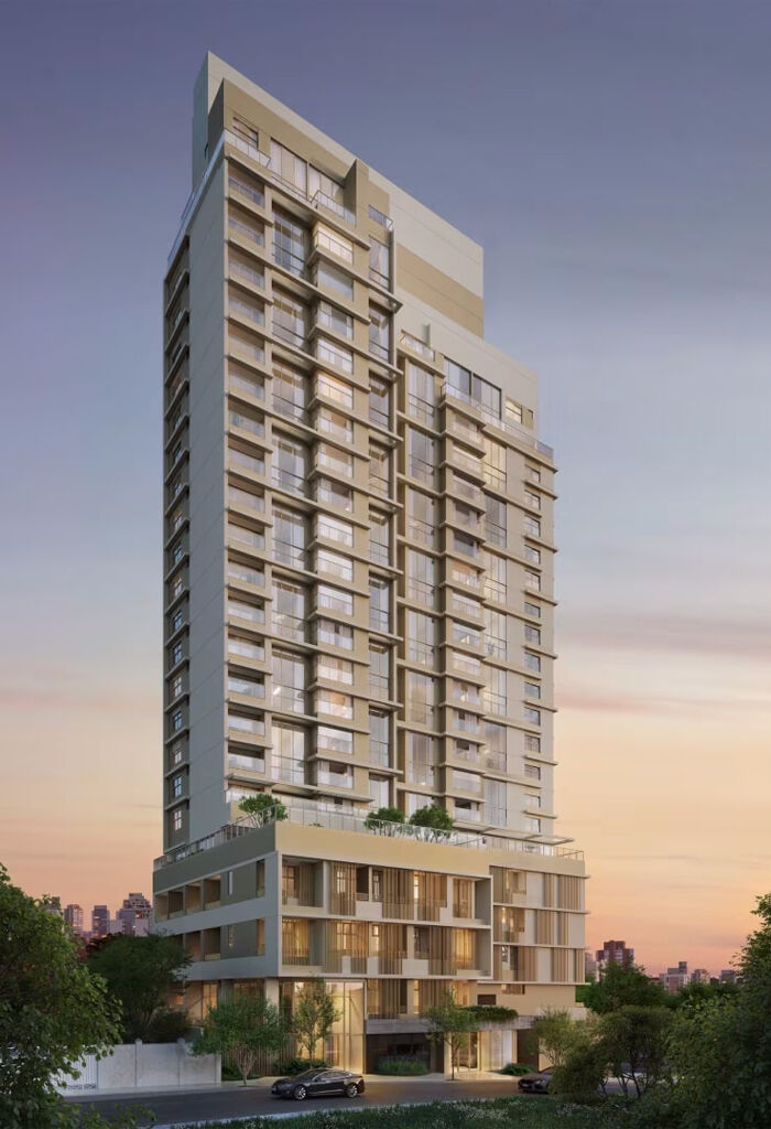 Edifício moderno com fachada elegante ao entardecer.