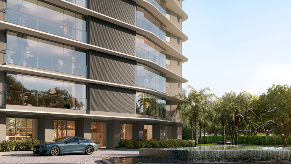 Fachada moderna de edifício com carro e jardim.