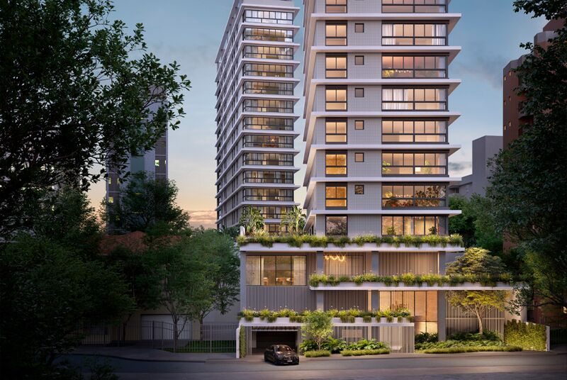 Edifício moderno com varandas verdes e estacionamento