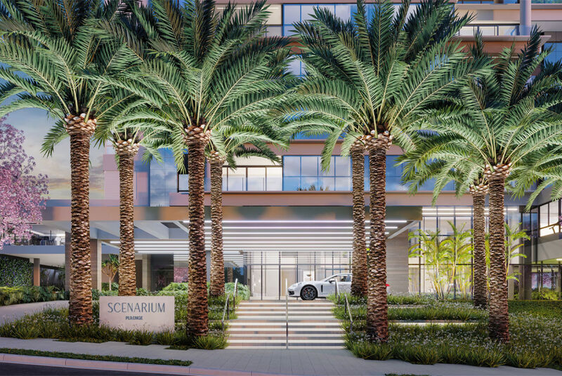 Entrada do edifício Scenarium com palmeiras exuberantes