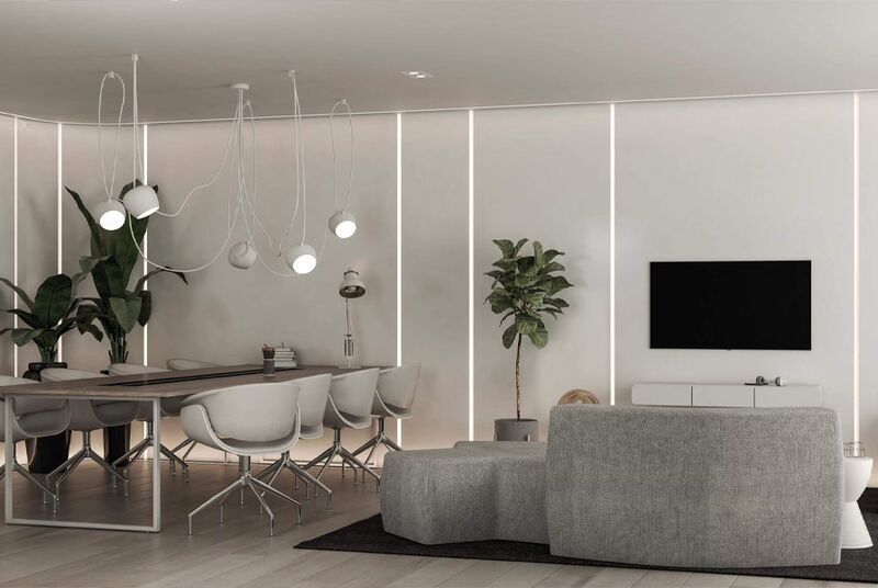Sala moderna com sofá, planta e mesa de jantar